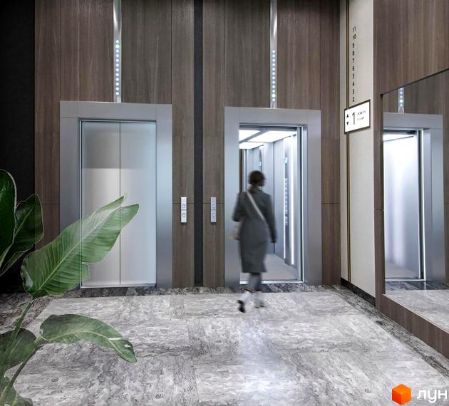 Інтер'єр холу з ліфтами в Житловому комплексі Uzh Towers. Вигляд ліфтової зони з покажчиком поверху.