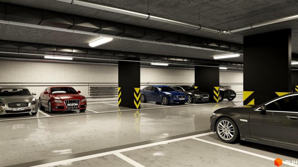 Підземний паркінг в ЖК Uzh Towers з автомобілями різних марок. Бетонні колони та стеля, розмітка паркомісць.