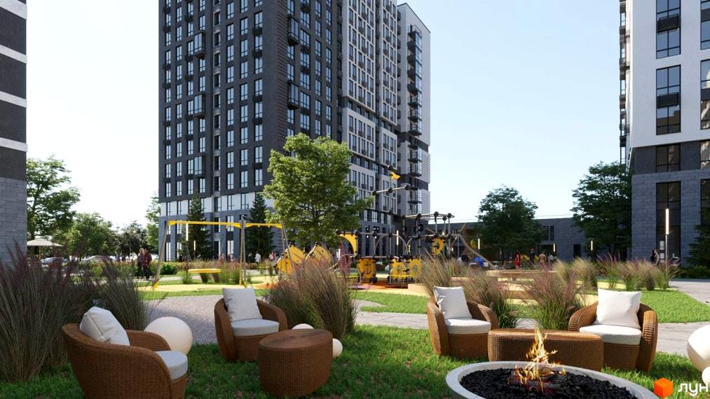 Житловий комплекс Vyshgorod Sky з високими будівлями та зоною відпочинку з кріслами та вогнищем. На території є дитячий майданчик з гойдалками.