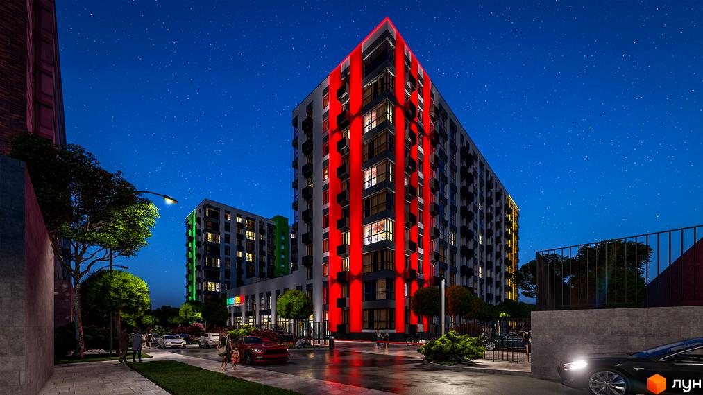 Житловий комплекс BARVY вночі з червоним та зеленим підсвічуванням фасадів. Навколо будівель розташовані дерева та автомобілі.