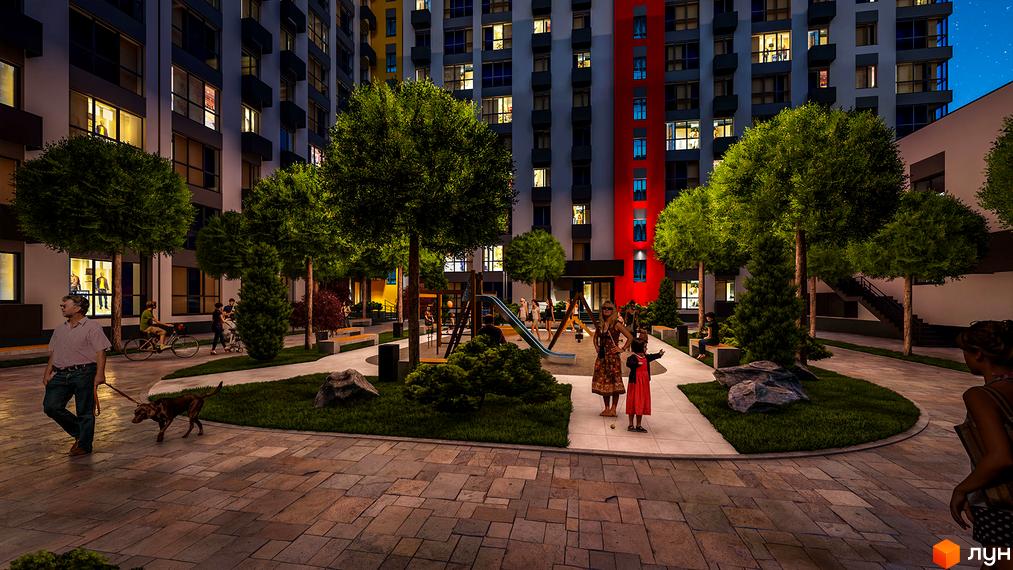 Житловий комплекс BARVY з яскравим фасадом, освітленням та озелененою прибудинковою територією з дитячим майданчиком.
