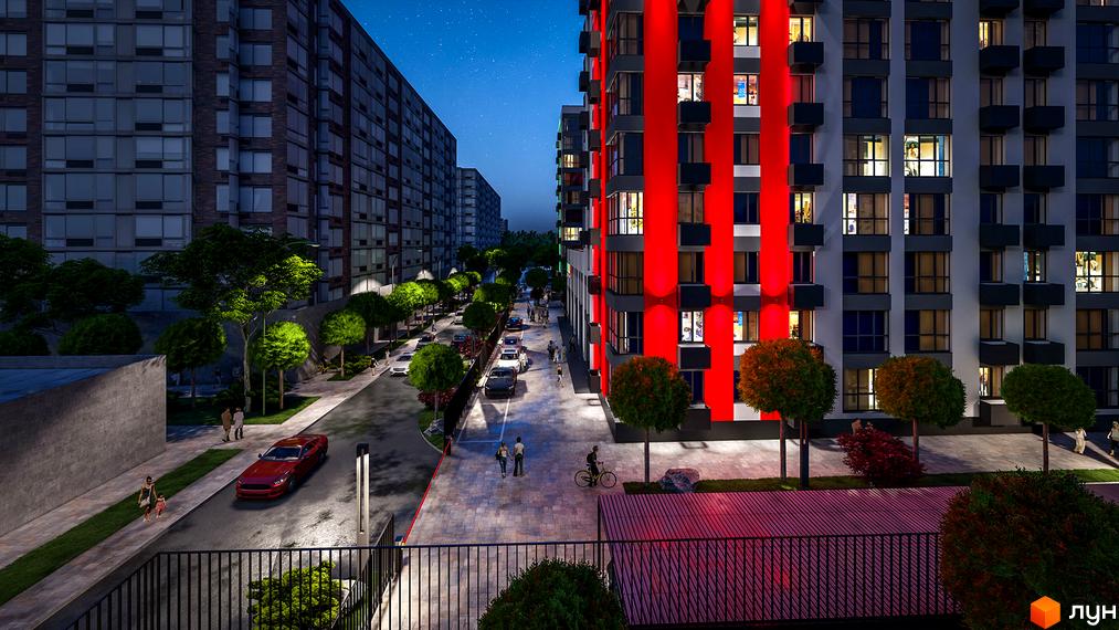 Житловий комплекс BARVY: багатоповерховий будинок з яскравою підсвіткою, доглянута прибудинкова територія з деревами та освітленням, вечірній вигляд.