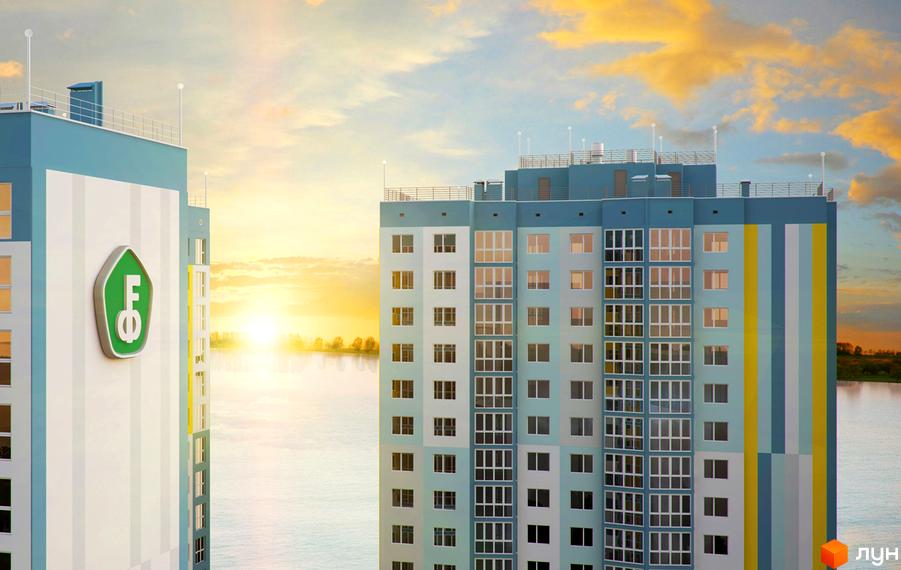 Новобудова ЖК Welcome Home на Ревуцького з блакитними та білими фасадами, розташована біля річки на фоні заходу сонця.