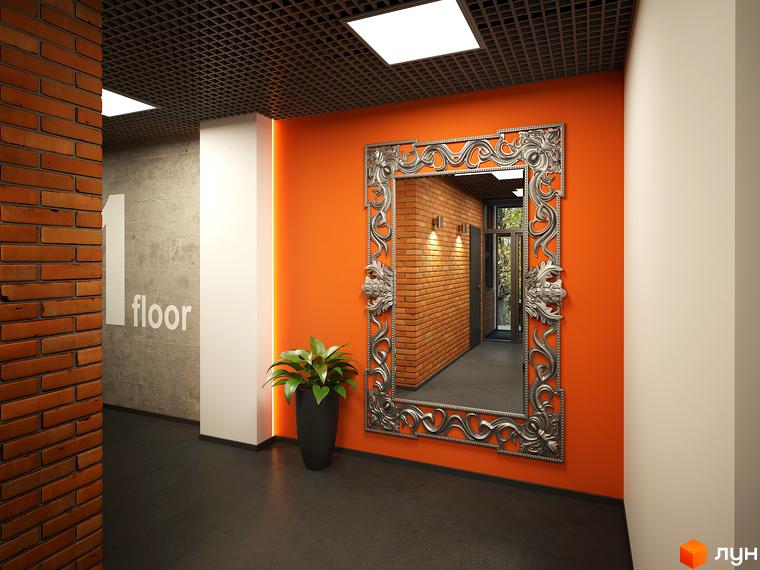 Інтер'єр холу в ЖК L-квартал. Яскрава помаранчева стіна з великим дзеркалом у срібній рамі, чорна підлога та рослина в горщику.