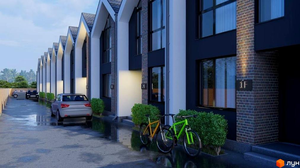 Таунхауси Dream Home з фасадами темного кольору та білими елементами, прибудинкова територія з велосипедами та автомобілями.