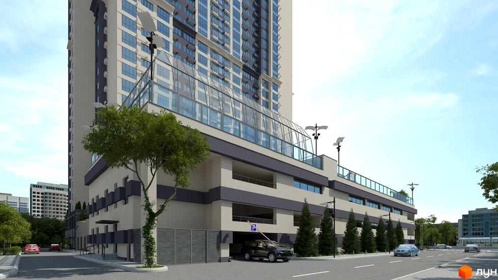 Зовнішній вигляд житлового комплексу Victory V з багатоповерховою будівлею та багаторівневим паркінгом. Навколо комплексу розташовані дерева та дорога з автомобілями.