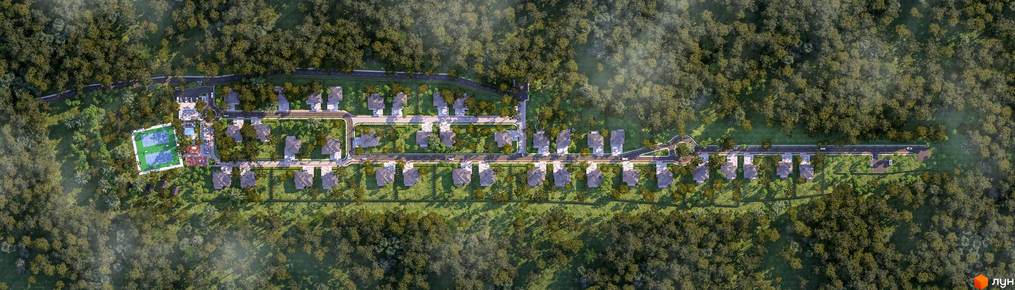 Вид зверху на Котеджне містечко PROЦВІТ VILLAGE. Одноповерхові будинки з темними дахами розташовані вздовж доріг, поруч ліс та спортивний майданчик.