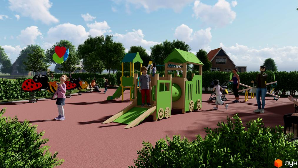 Дитячий майданчик у дворі житлового комплексу. На території є гірки, гойдалки та інші розваги для дітей.