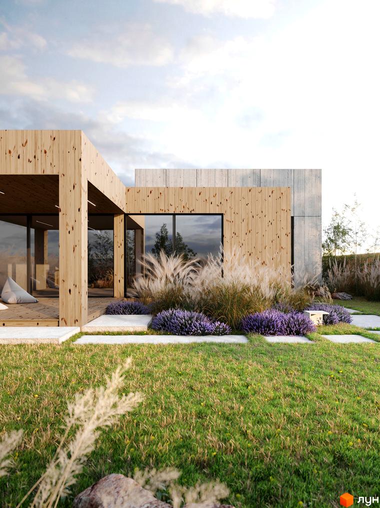 Сучасний житловий комплекс з дерев'яним фасадом та бетонними елементами. Навколо будинку доглянутий газон, лаванда та декоративні трави.