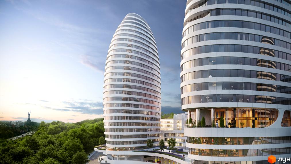 Дві високі білі будівлі овальної форми з панорамними вікнами та горизонтальними елементами. Навколо БФК INTERGAL CITY зелені насадження та облаштовані тераси.