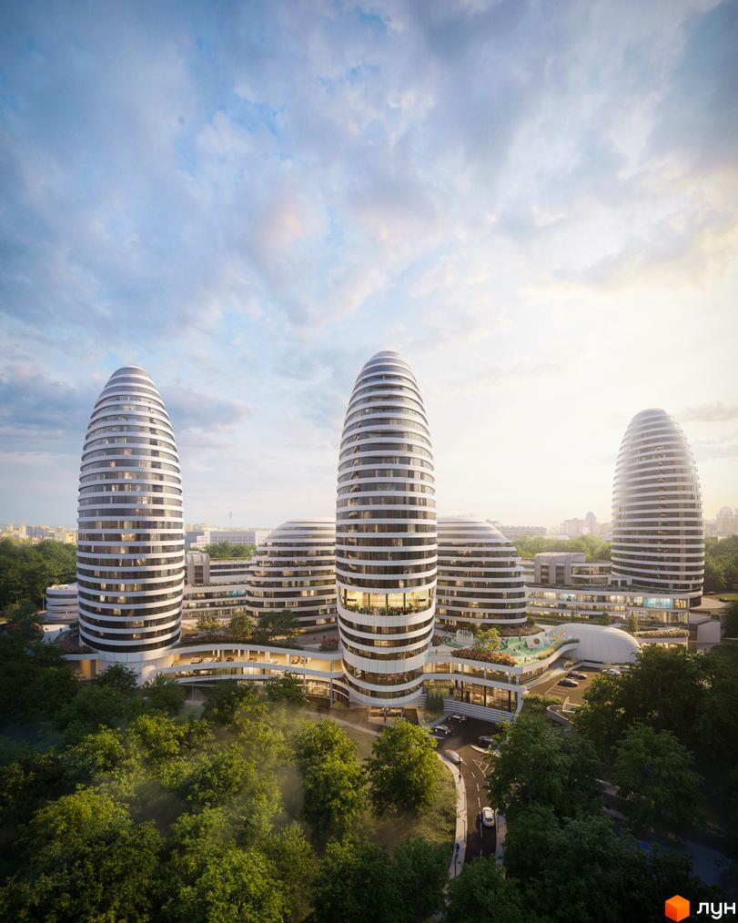 Високі будівлі з білими смугами на фасаді. На території ЖК INTERGAL CITY є зелені насадження, дитячий майданчик та парковка.