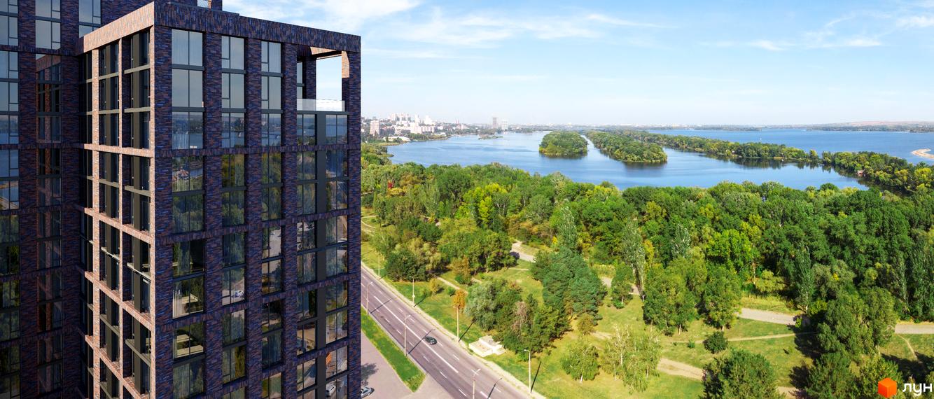 Будинок ЖК MARSHALL з цегляним фасадом та панорамними вікнами, що виходить на зелену зону та річку.