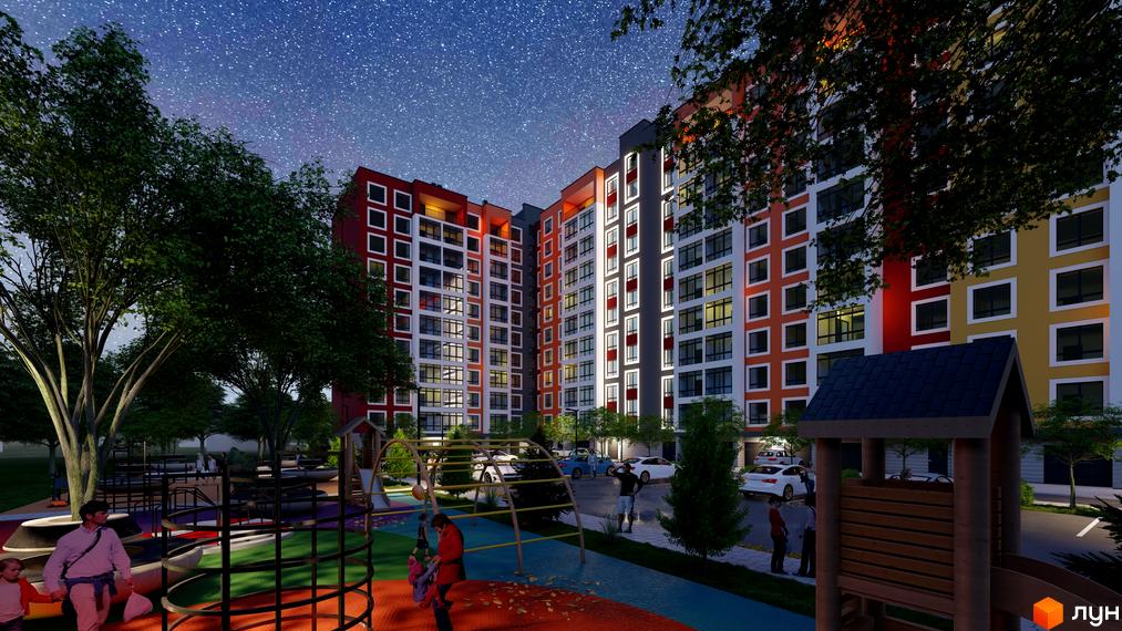 Житловий комплекс Янтарний з яскравим фасадом та дитячим майданчиком у вечірній час. Новобудова з сучасним дизайном та освітленням.