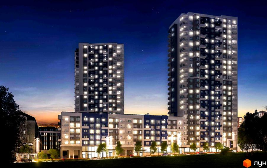 Новобудова ЖК Воздухофлотський квартал вночі. Багатоповерхові будинки з підсвіченими вікнами та балконами, перед ними зелена зона з деревами та освітленням.