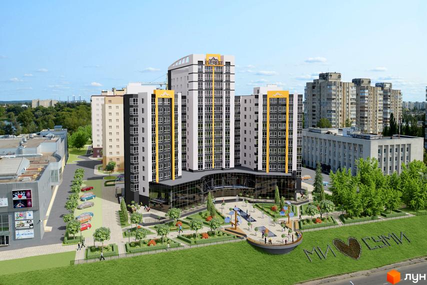 Житловий комплекс Еверест з фасадами білого, сірого та жовтого кольорів, скляним цоколем та упорядкованою прибудинковою територією з зонами відпочинку.