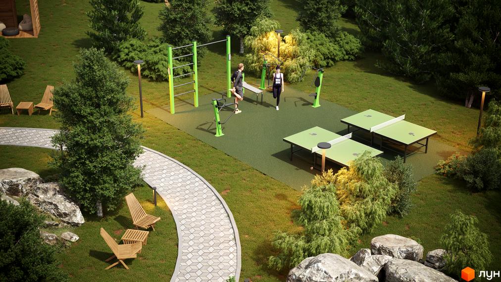 Котеджне містечко КМ Затишний: зона відпочинку з тренажерами та столами для настільного тенісу, облаштована доріжками та місцями для сидіння.