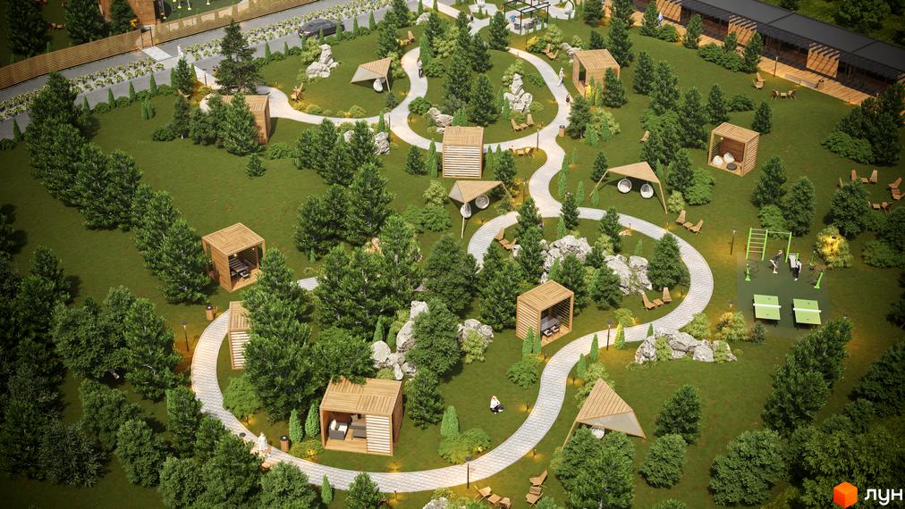 Котеджне містечко Затишний з невисокими будинками та великою зеленою територією, що включає дерев'яні альтанки, доріжки та спортивні зони.