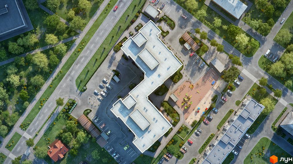 Вид зверху на житловий комплекс на вул. Вірменська, 6а. Будинок має незвичайну Г-подібну форму, поруч розташовані дитячий майданчик та парковка.