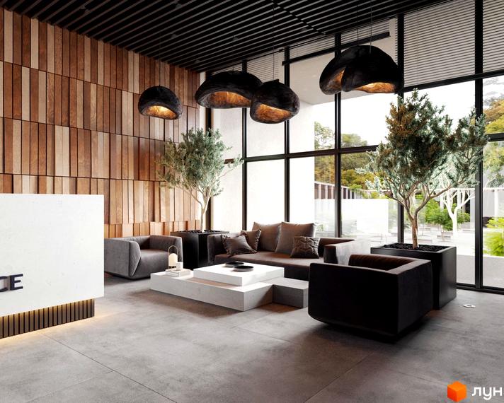 Інтер'єр холу в ЖК Park Residence з дерев'яною стіною, диванами, рослинами та великими вікнами з видом на зелену територію.