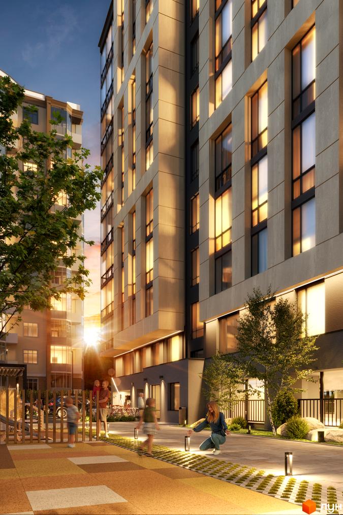 Висотна будівля житлового комплексу з великими вікнами. На території ЖК облаштований дитячий майданчик та зони відпочинку.
