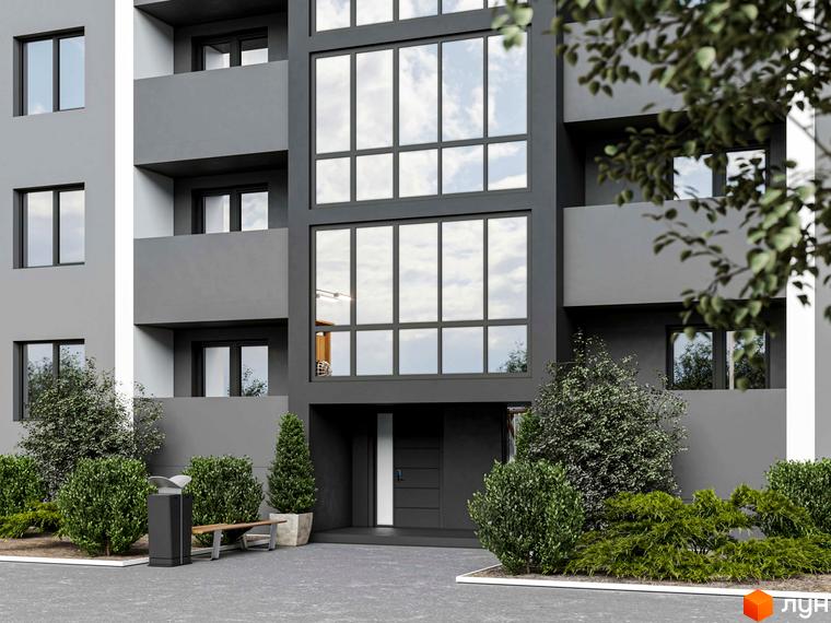 Фасад будинку Житлового комплексу Північний з сірими стінами та великими вікнами. Прибудинкова територія облаштована зеленими насадженнями, лавкою та урною.