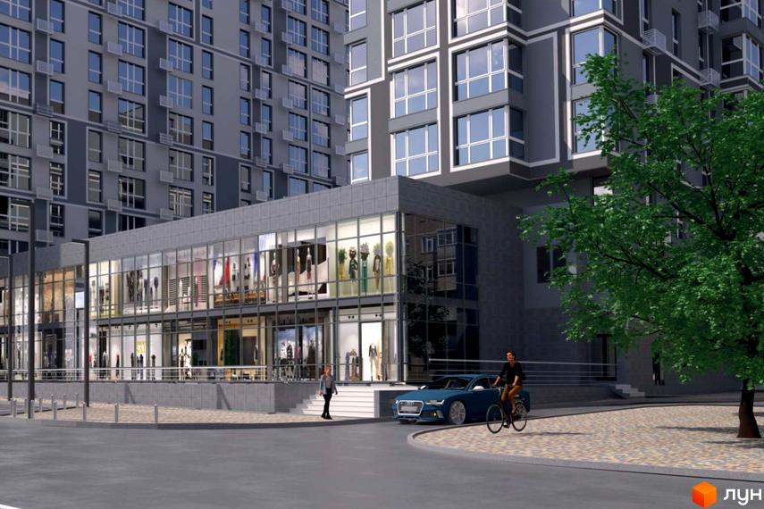 Житловий комплекс Урбаніст: сірий багатоповерховий будинок зі скляними вітринами магазинів на першому поверсі та зеленим деревом поруч.