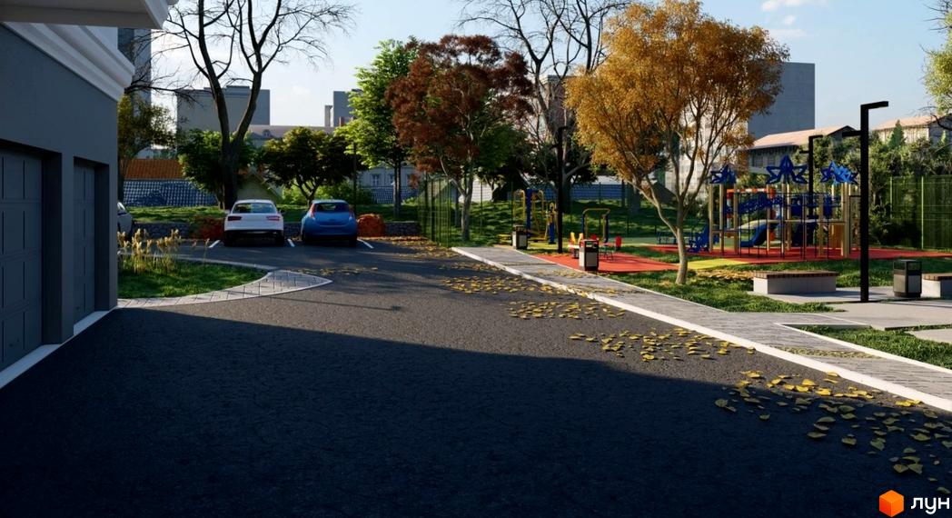 Житловий комплекс Слов'янський: сучасний фасад будинку та облаштований двір з дитячим майданчиком та парковкою.