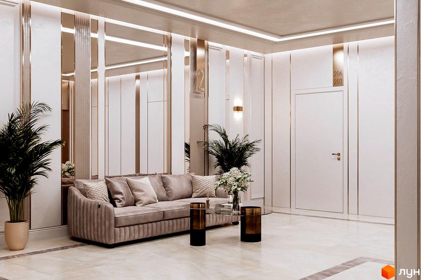 Інтер'єр холу клубного будинку LA MANCHE з диваном, журнальним столиком та рослинами. Розкішний дизайн та оздоблення створюють затишну атмосферу.