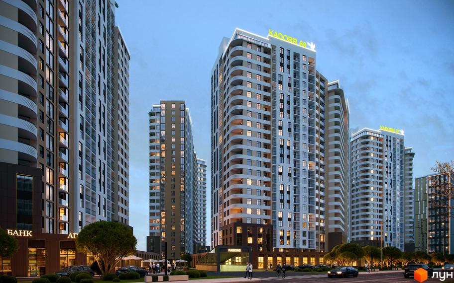 Зовнішній вигляд житлового комплексу KADORR City з високими будівлями та балконами, освітленою прибудинковою територією та деревами.