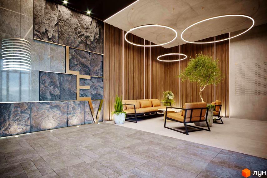 Інтер'єр холу Житлового комплексу Life Story з диваном, кріслами та декоративним озелененням. Освітлення у вигляді кілець на стелі.