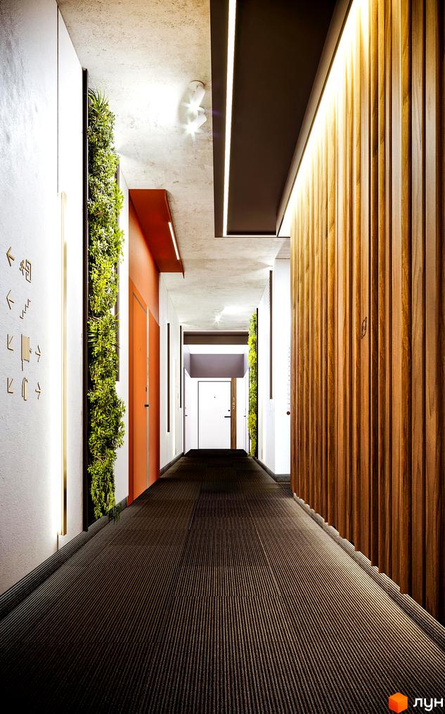Інтер'єрний коридор Житлового комплексу Life Story з елементами вертикального озеленення, дерев'яними стіновими панелями та вбудованим освітленням.