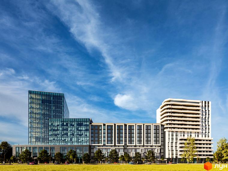 Багатоповерховий будинок Washington City з панорамними вікнами на тлі блакитного неба. Перед будинком зелена галявина з деревами.