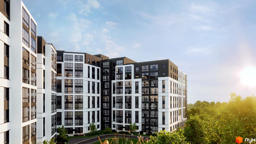 Житловий комплекс Атмосфера з білими та чорними фасадами. На території є дитячий майданчик та зелені насадження.