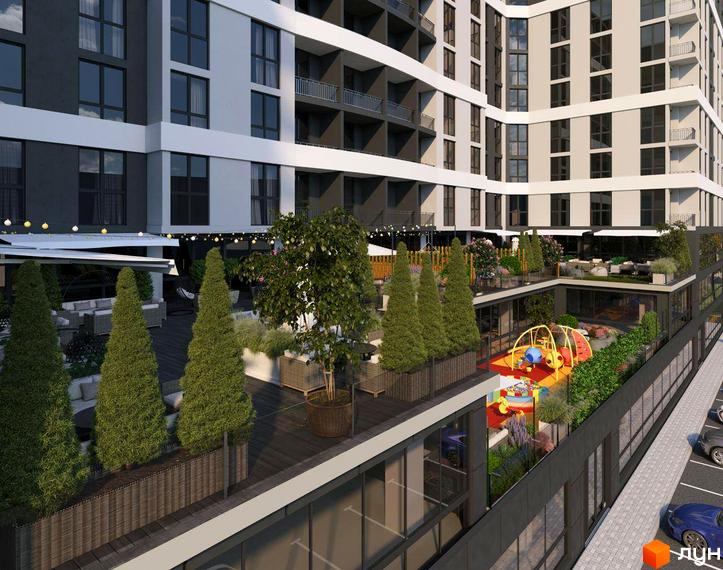 Житловий комплекс GRAND HALL з фасадом з білих та сірих елементів та прибудинковою територією з дитячим майданчиком та зонами відпочинку.