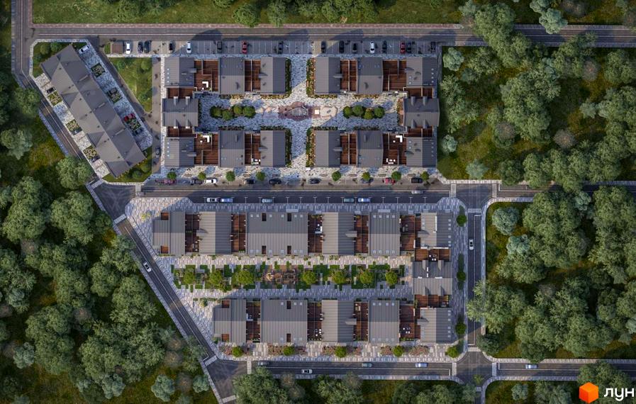 Вид зверху на житловий комплекс Viking Home з сірими дахами та прибудинковою територією з деревами та парковкою.