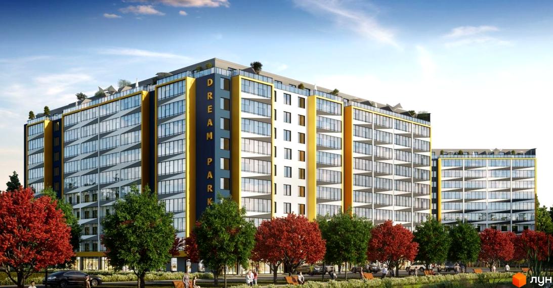 Висотна будівля ЖК Dream Park з великими вікнами та балконами. На передньому плані дерева з червоним листям та зелені насадження, люди.
