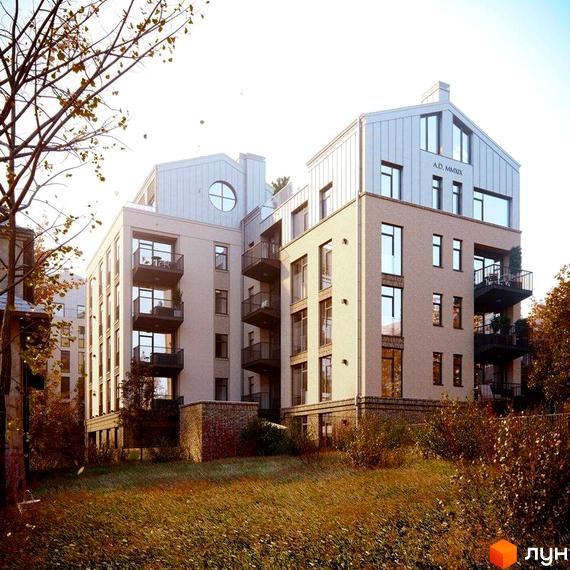 Житловий комплекс Княжий Холл: багатоповерховий будинок світлого кольору з балконами та металевим дахом, оточений осінньою рослинністю на схилі.