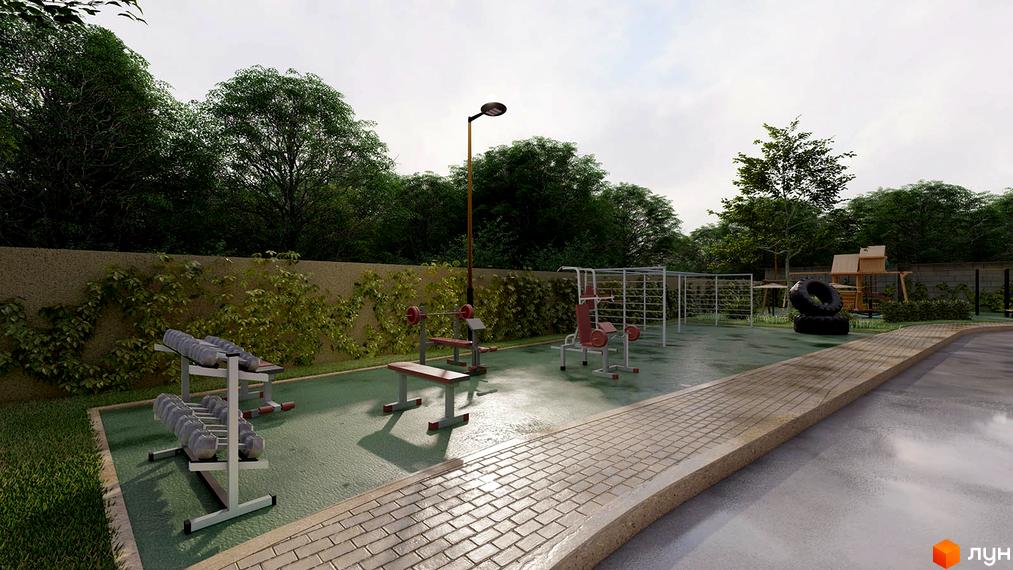 Спортивний майданчик житлового комплексу. На території є тренажери, лавки, зелені насадження та бруківка.