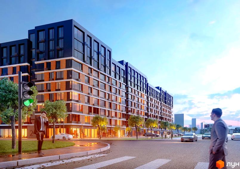 Житловий комплекс Євромісто 2 - це сучасна новобудова з цегляним фасадом та великими вікнами, розташована біля дороги з пішохідним переходом.