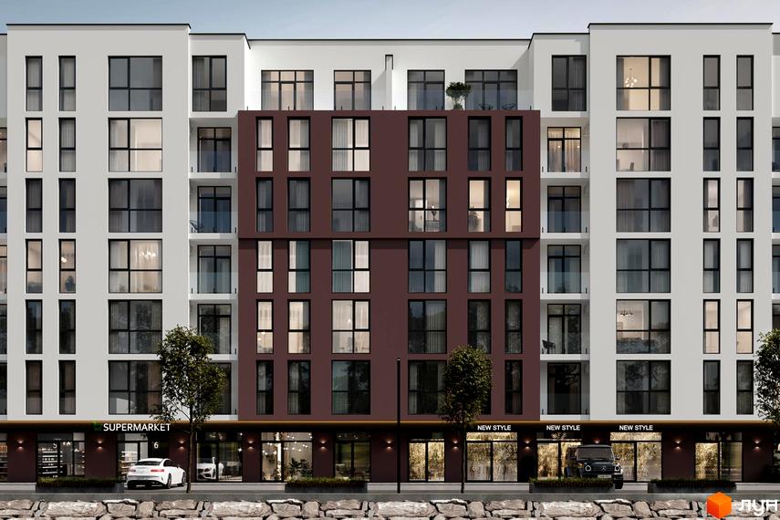 Фасад Житлового комплексу Набережний квартал з білими та коричневими секціями, великими вікнами. На першому поверсі видно магазини.