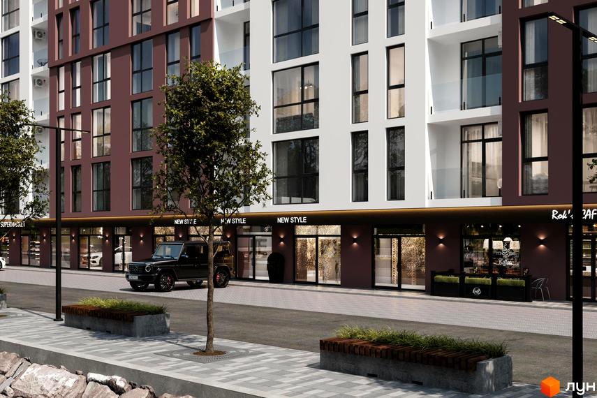 Житловий комплекс Набережний квартал: будинок з коричнево-білим фасадом та магазинами на першому поверсі. Вулиця з деревами та лавами.