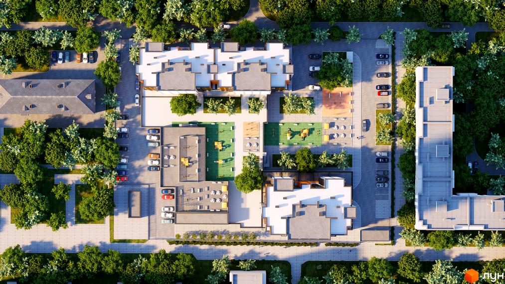 Вид зверху на будівлі Житлового комплексу Городок з парковкою, дитячим майданчиком та зеленими насадженнями навколо.