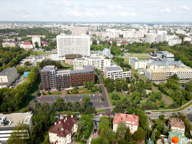 Житловий комплекс Еко-дім на Козельницькій має багатоповерхову забудову з коричнево-сірими фасадами. Навколо комплексу розташовані зелені зони, пішохідні доріжки та паркінги.