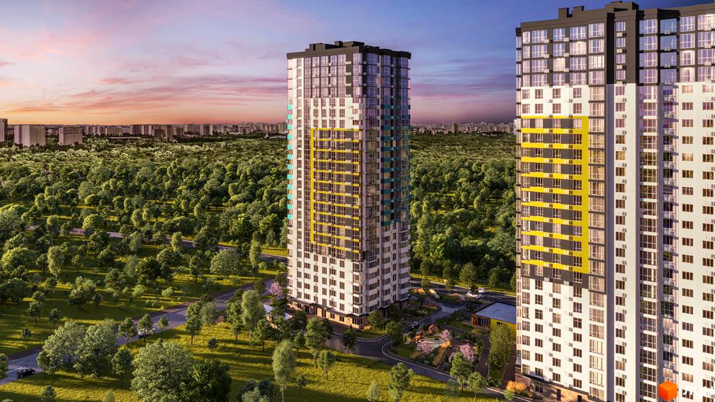 Вид на новобудову ЖК Теремки з висоти пташиного польоту. Багатоповерховий будинок оточений зеленим лісом та міською забудовою на горизонті.