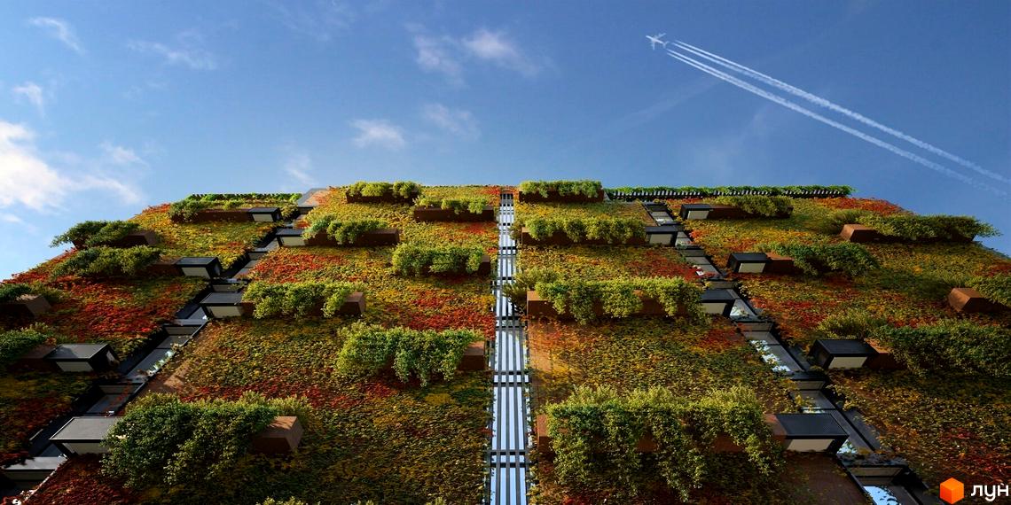 Будинок з вертикальним озелененням та каскадними терасами на вулиці Болсуновська, 16. Зелені насадження покривають фасад будівлі, створюючи природний вигляд.