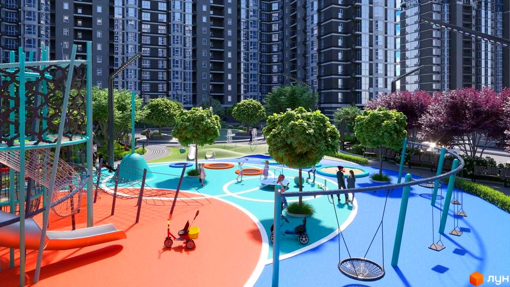 Багатоповерхові будинки Житлового комплексу Гранд Бурже з темним фасадом. На передньому плані яскравий дитячий майданчик з гірками, гойдалками та зеленими деревами.