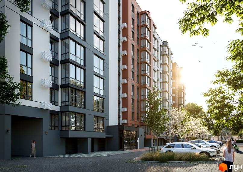 Зовнішній вигляд будинку ЖК Молодіжний з великими вікнами та балконами, що виходять на доглянуту прибудинкову територію з деревами та автомобілями.