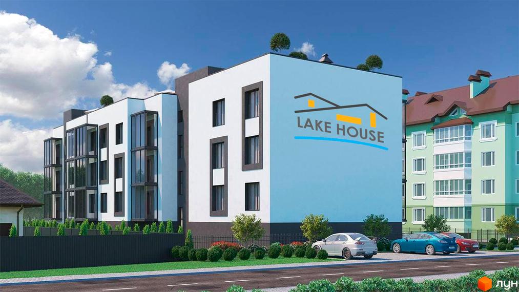 Новобудова Lake House з білим фасадом та скляними балконами. Поруч дорога, парковка та озеленена територія.