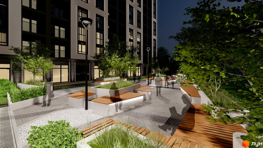 Зовнішній вигляд житлового комплексу Квартал №5 з підсвіченими вікнами та балконами, з прибудинковою територією з лавками та деревами.