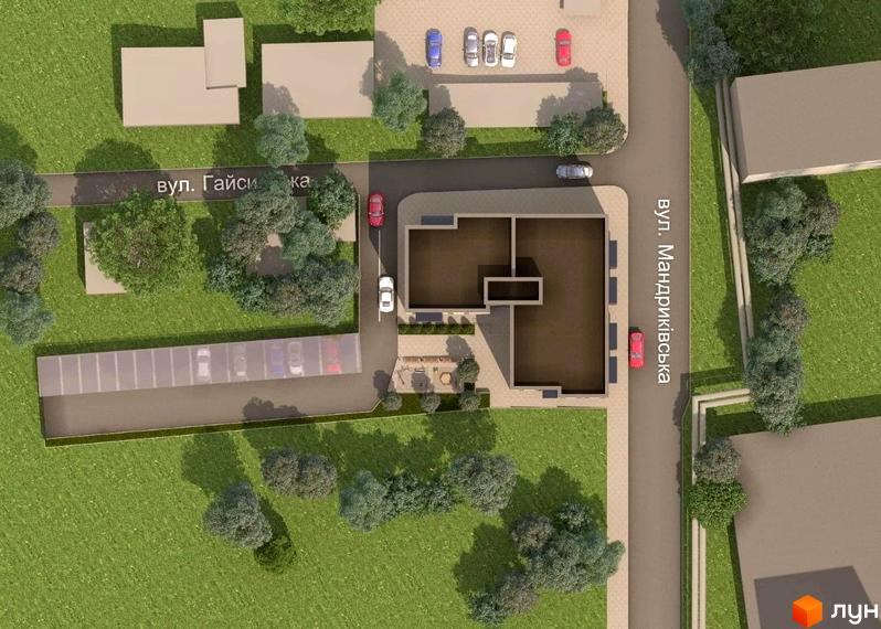 Вигляд з висоти пташиного польоту на будівлю ЖК Затишний дім з прилеглою територією, парковкою та зеленими насадженнями.